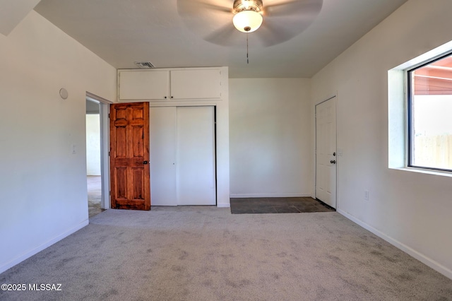 1125 W Huron St, Tucson, AZ 85745 - unfurnished bedroom with carpet, a closet, and a ceiling fan