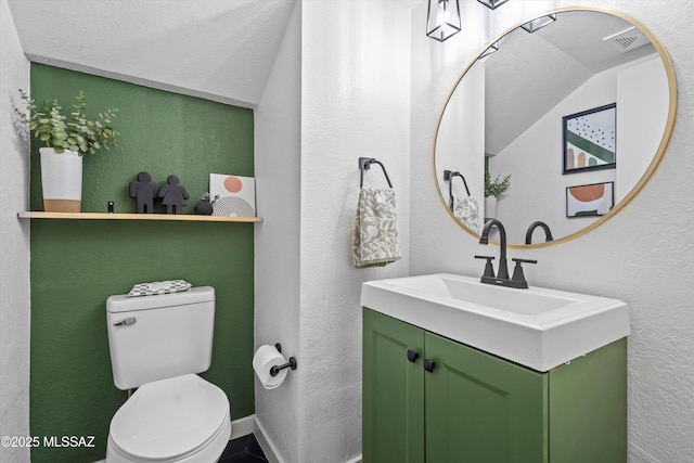 1441 N Calle De Durazo, Tucson, AZ 85715 - bathroom featuring vanity, a textured wall, and lofted ceiling