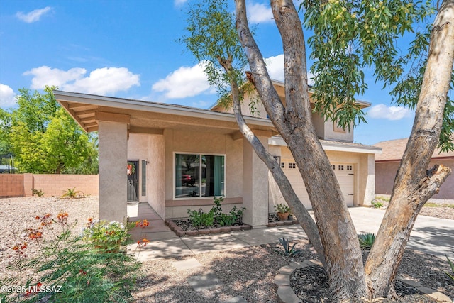1441 N Calle De Durazo, Tucson, AZ 85715 - view of front of house with a garage, stucco siding, and driveway