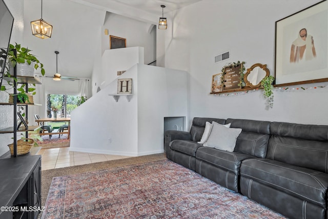 1441 N Calle De Durazo, Tucson, AZ 85715 - living room featuring a high ceiling, tile patterned floors, ceiling fan, and a chandelier