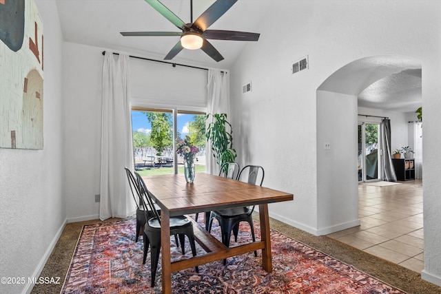 1441 N Calle De Durazo, Tucson, AZ 85715 - dining space with arched walkways, a ceiling fan, high vaulted ceiling, and a textured wall
