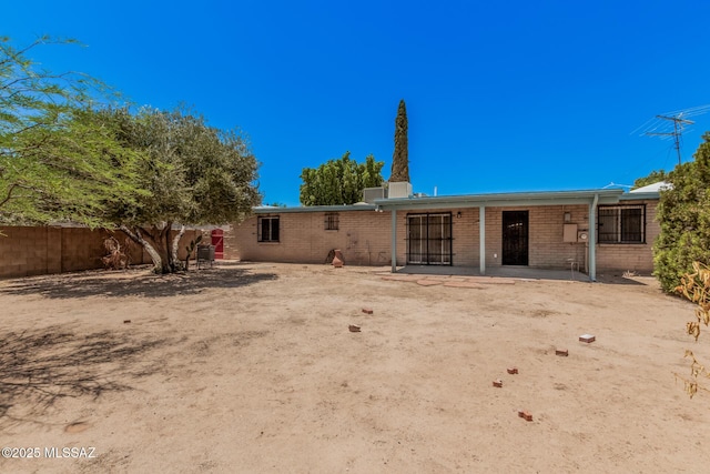 7208 E Toronto St, Tucson, AZ 85730 - rear view of house featuring a patio area and brick siding