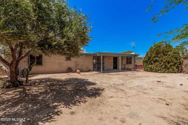 7208 E Toronto St, Tucson, AZ 85730 - back of house featuring brick siding
