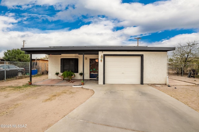 801 W Idaho St, Tucson, AZ 85706 - ranch-style home featuring a garage, stucco siding, and driveway