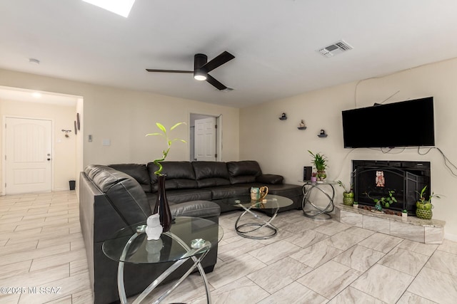 801 W Idaho St, Tucson, AZ 85706 - living room with a fireplace with raised hearth and ceiling fan