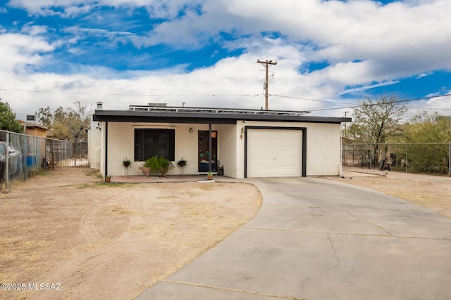 801 W Idaho St, Tucson, AZ 85706 - view of front of property with stucco siding, driveway, and a garage