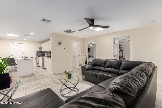 801 W Idaho St, Tucson, AZ 85706 - living room featuring a ceiling fan and recessed lighting
