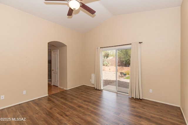 5566 W Dove Of Peace Dr, Marana, AZ 85658 - empty room with arched walkways, a ceiling fan, wood finished floors, and high vaulted ceiling