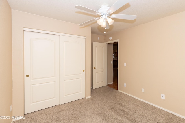 5566 W Dove Of Peace Dr, Marana, AZ 85658 - unfurnished bedroom featuring a closet, carpet, and a ceiling fan