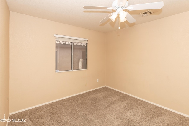 5566 W Dove Of Peace Dr, Marana, AZ 85658 - empty room with carpet and a ceiling fan