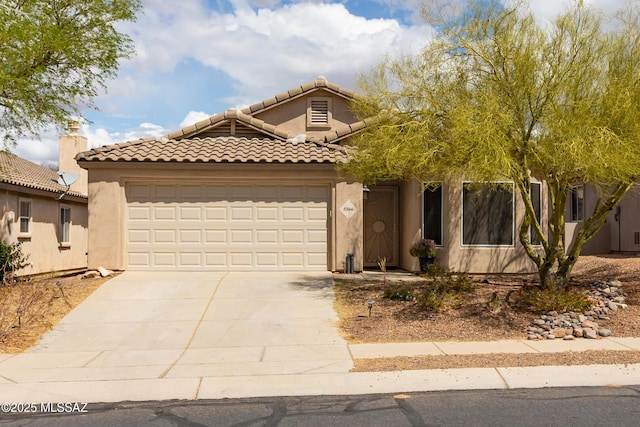 5566 W Dove Of Peace Dr, Marana, AZ 85658 - view of front facade featuring driveway, an attached garage, stucco siding, and a tiled roof