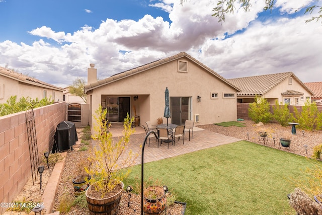 5566 W Dove Of Peace Dr, Marana, AZ 85658 - rear view of house featuring stucco siding, a fenced backyard, a chimney, and a patio