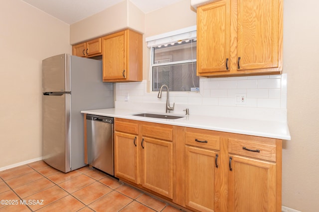 5566 W Dove Of Peace Dr, Marana, AZ 85658 - kitchen featuring appliances with stainless steel finishes, tasteful backsplash, light tile patterned floors, and light countertops