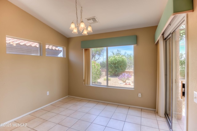 13491 N Tom Ryans Way, Oro Valley, AZ 85755 - empty room featuring a chandelier, lofted ceiling, and light tile patterned flooring
