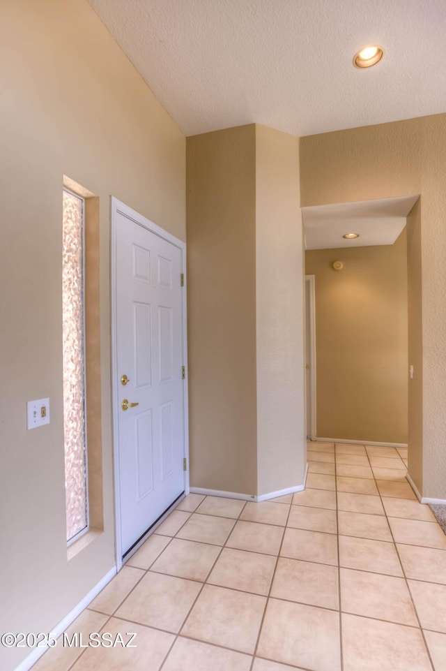 13491 N Tom Ryans Way, Oro Valley, AZ 85755 - foyer with a textured ceiling and light tile patterned floors