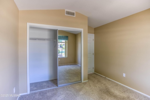 13491 N Tom Ryans Way, Oro Valley, AZ 85755 - unfurnished bedroom with vaulted ceiling, carpet floors, and a closet