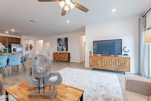 10490 W Beaman Ln, Marana, AZ 85653 - living room featuring ceiling fan, light wood finished floors, and recessed lighting