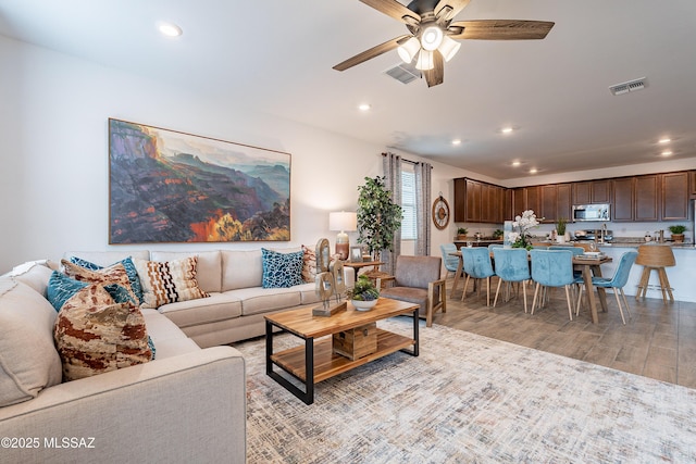 10490 W Beaman Ln, Marana, AZ 85653 - living area with a ceiling fan, light wood finished floors, and recessed lighting