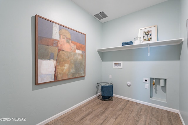 10490 W Beaman Ln, Marana, AZ 85653 - laundry room featuring gas dryer hookup, washer hookup, wood finished floors, and electric dryer hookup