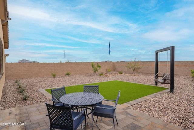 10490 W Beaman Ln, Marana, AZ 85653 - fenced backyard with a patio and outdoor dining area