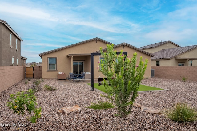 10490 W Beaman Ln, Marana, AZ 85653 - back of property with a gate, stucco siding, a fenced backyard, and a patio area