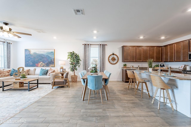 10490 W Beaman Ln, Marana, AZ 85653 - dining area with healthy amount of natural light, recessed lighting, a ceiling fan, and light wood-style flooring