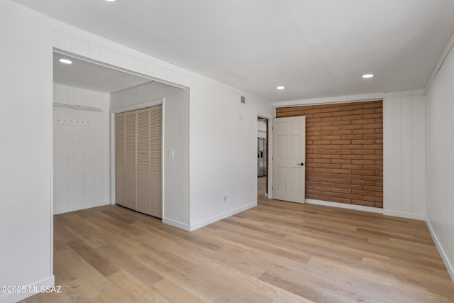 3632 W Horizon Hills Dr, Tucson, AZ 85741 - empty room with light wood-style floors, recessed lighting, brick wall, and crown molding