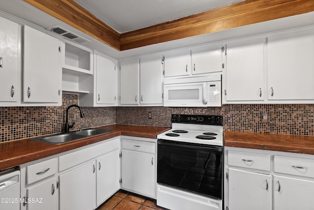 4812 E 3rd St, Tucson, AZ 85711 - kitchen featuring white appliances, open shelves, dark countertops, white cabinetry, and decorative backsplash