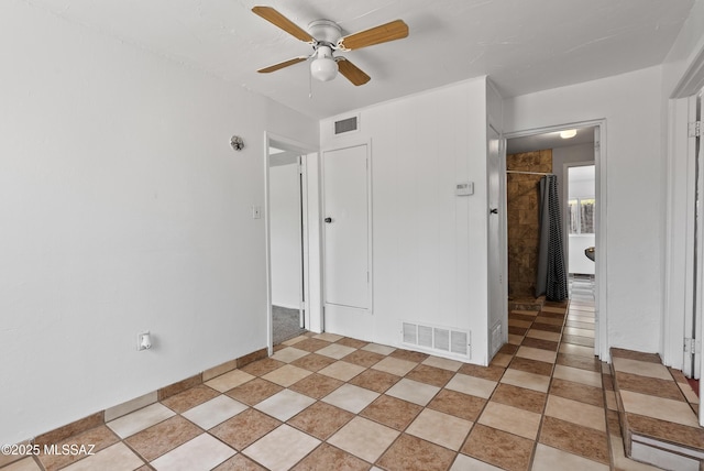 4812 E 3rd St, Tucson, AZ 85711 - unfurnished bedroom with a ceiling fan and light tile patterned floors