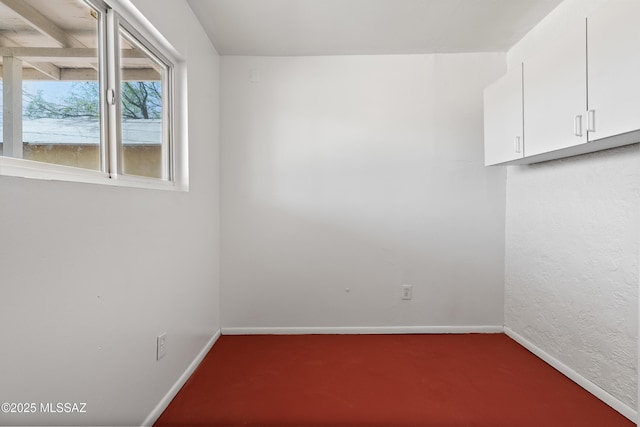 4812 E 3rd St, Tucson, AZ 85711 - carpeted empty room with baseboards