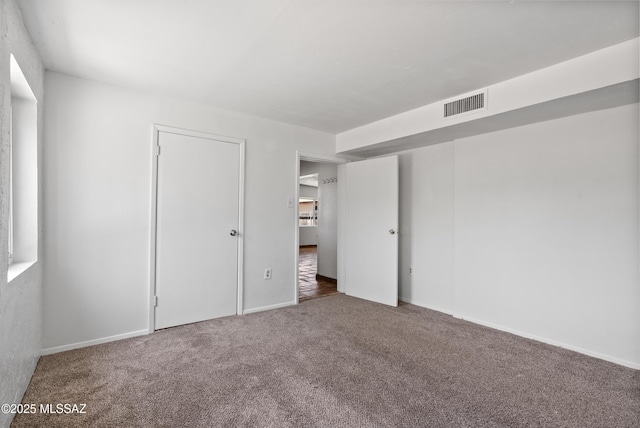 4812 E 3rd St, Tucson, AZ 85711 - unfurnished bedroom featuring carpet flooring and baseboards