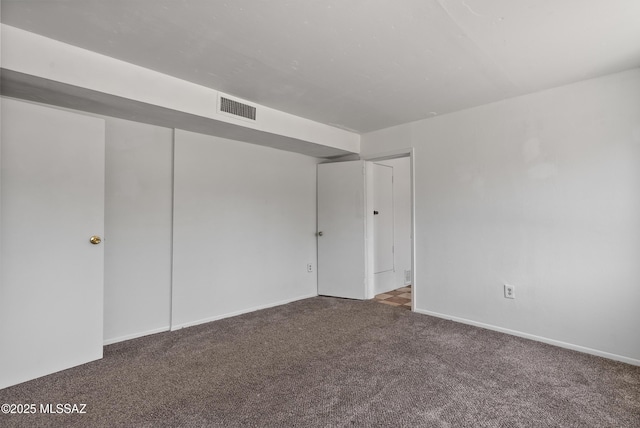 4812 E 3rd St, Tucson, AZ 85711 - carpeted spare room featuring baseboards