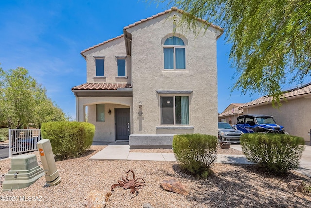 10567 E Desert Drifter Pl, Tucson, AZ 85747 - mediterranean / spanish-style home with a tile roof and stucco siding
