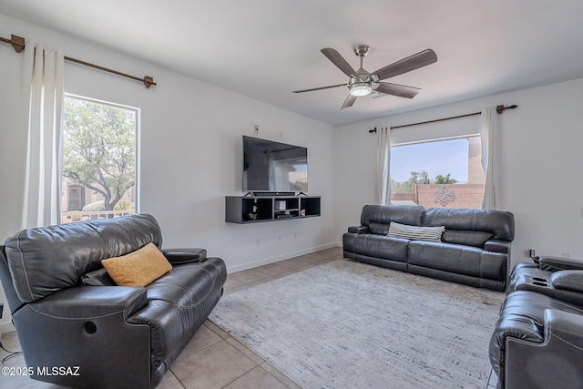 10567 E Desert Drifter Pl, Tucson, AZ 85747 - living area featuring healthy amount of natural light, light tile patterned floors, and ceiling fan