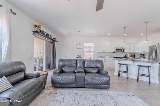 10567 E Desert Drifter Pl, Tucson, AZ 85747 - living area featuring light tile patterned flooring, a ceiling fan, and recessed lighting