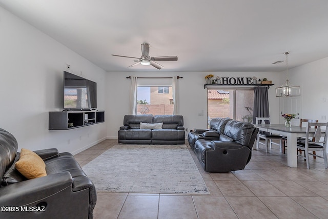10567 E Desert Drifter Pl, Tucson, AZ 85747 - living room featuring light tile patterned floors and a ceiling fan