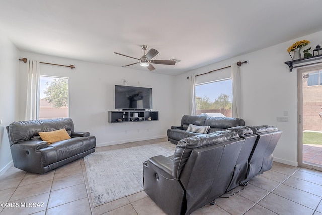 10567 E Desert Drifter Pl, Tucson, AZ 85747 - living area featuring light tile patterned flooring, a ceiling fan, and healthy amount of natural light