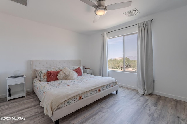 10567 E Desert Drifter Pl, Tucson, AZ 85747 - bedroom featuring wood finished floors and a ceiling fan