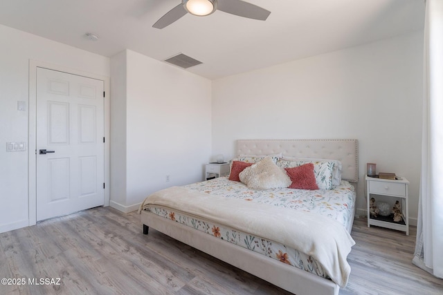 10567 E Desert Drifter Pl, Tucson, AZ 85747 - bedroom with wood finished floors and a ceiling fan