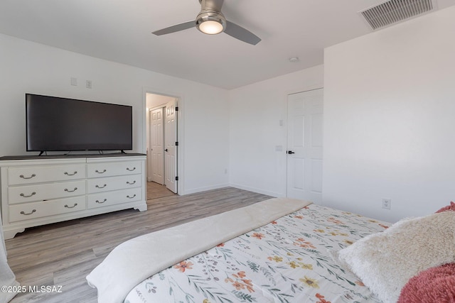 10567 E Desert Drifter Pl, Tucson, AZ 85747 - bedroom with light wood finished floors and a ceiling fan