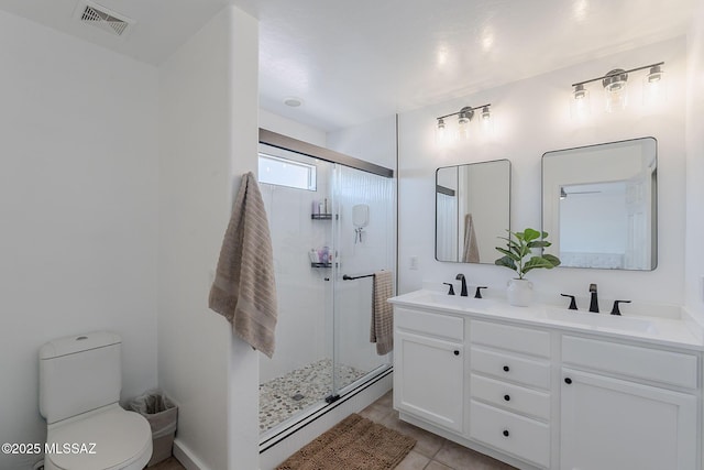 10567 E Desert Drifter Pl, Tucson, AZ 85747 - bathroom featuring double vanity, a shower stall, and tile patterned flooring