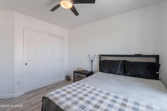 10567 E Desert Drifter Pl, Tucson, AZ 85747 - bedroom with wood finished floors and a ceiling fan