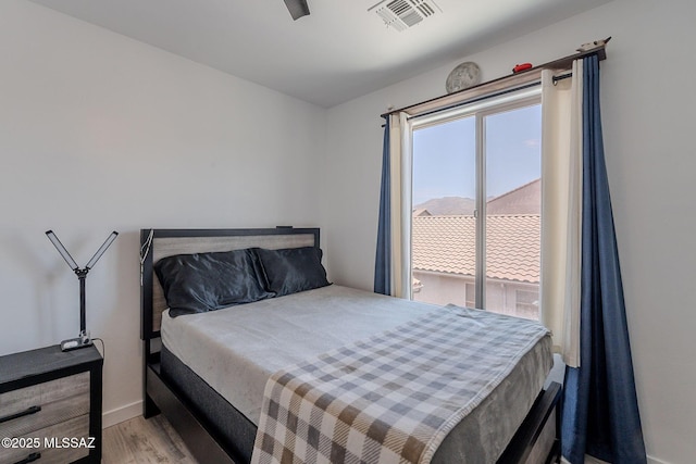 10567 E Desert Drifter Pl, Tucson, AZ 85747 - bedroom with wood finished floors and baseboards