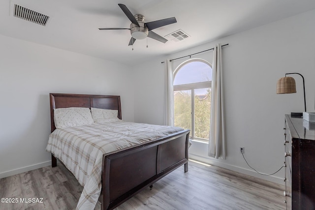 10567 E Desert Drifter Pl, Tucson, AZ 85747 - bedroom with wood finished floors and ceiling fan