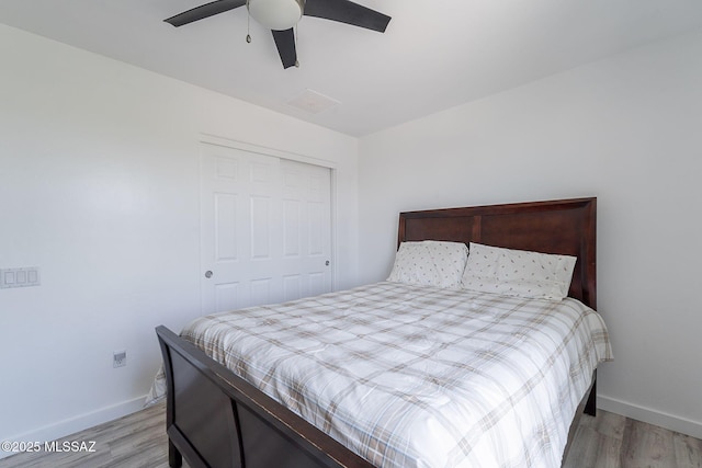 10567 E Desert Drifter Pl, Tucson, AZ 85747 - bedroom featuring light wood finished floors, ceiling fan, and a closet