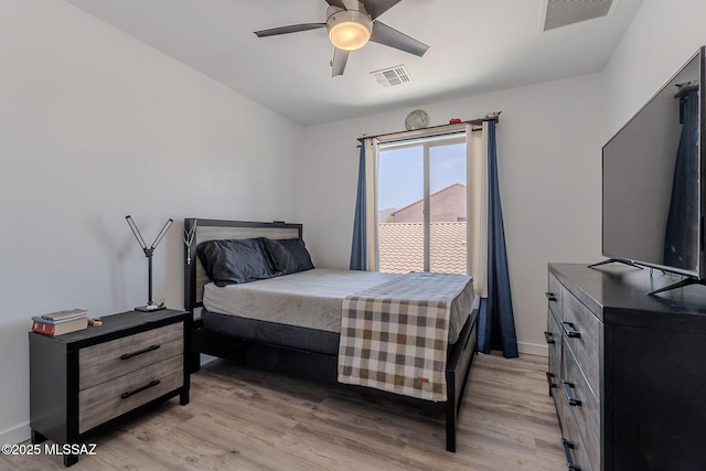 10567 E Desert Drifter Pl, Tucson, AZ 85747 - bedroom featuring light wood-style floors and ceiling fan