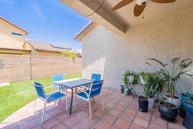 10567 E Desert Drifter Pl, Tucson, AZ 85747 - view of patio / terrace with outdoor dining area and a ceiling fan