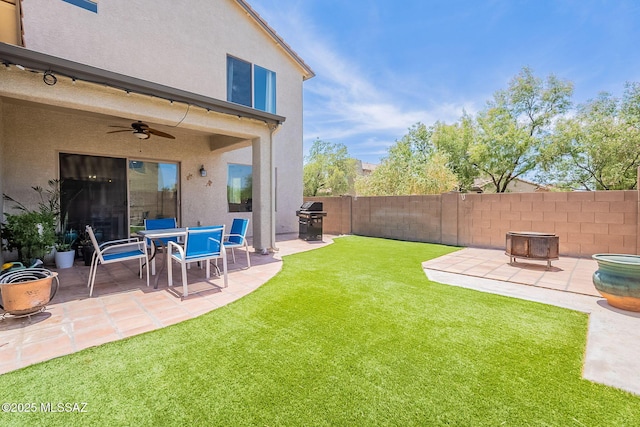 10567 E Desert Drifter Pl, Tucson, AZ 85747 - view of yard with a patio, a ceiling fan, and an outdoor fire pit