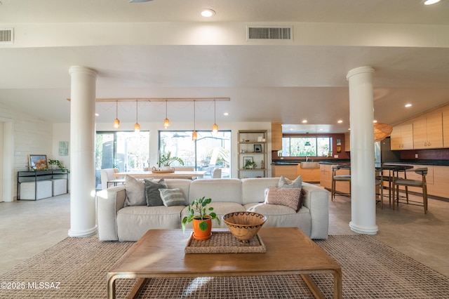 1115 W Santo Domingo Cir, Tucson, AZ 85704 - living area with ornate columns and recessed lighting