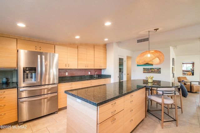 1115 W Santo Domingo Cir, Tucson, AZ 85704 - kitchen with stainless steel refrigerator with ice dispenser, light brown cabinets, light tile patterned floors, a center island, and recessed lighting